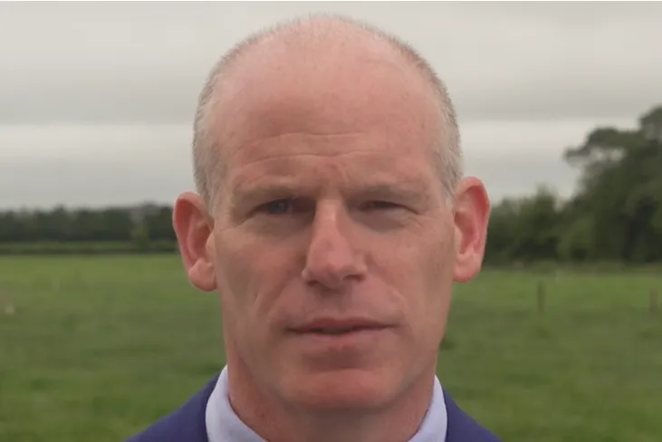 A close-up picture of a mans face with a green field in the background | FBD Insurance