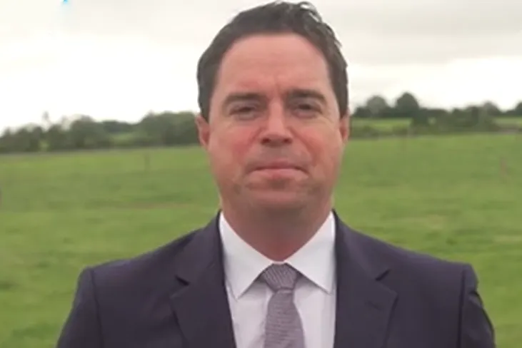 A close-up picture of a mans face with a green field in the background | FBD Insurance